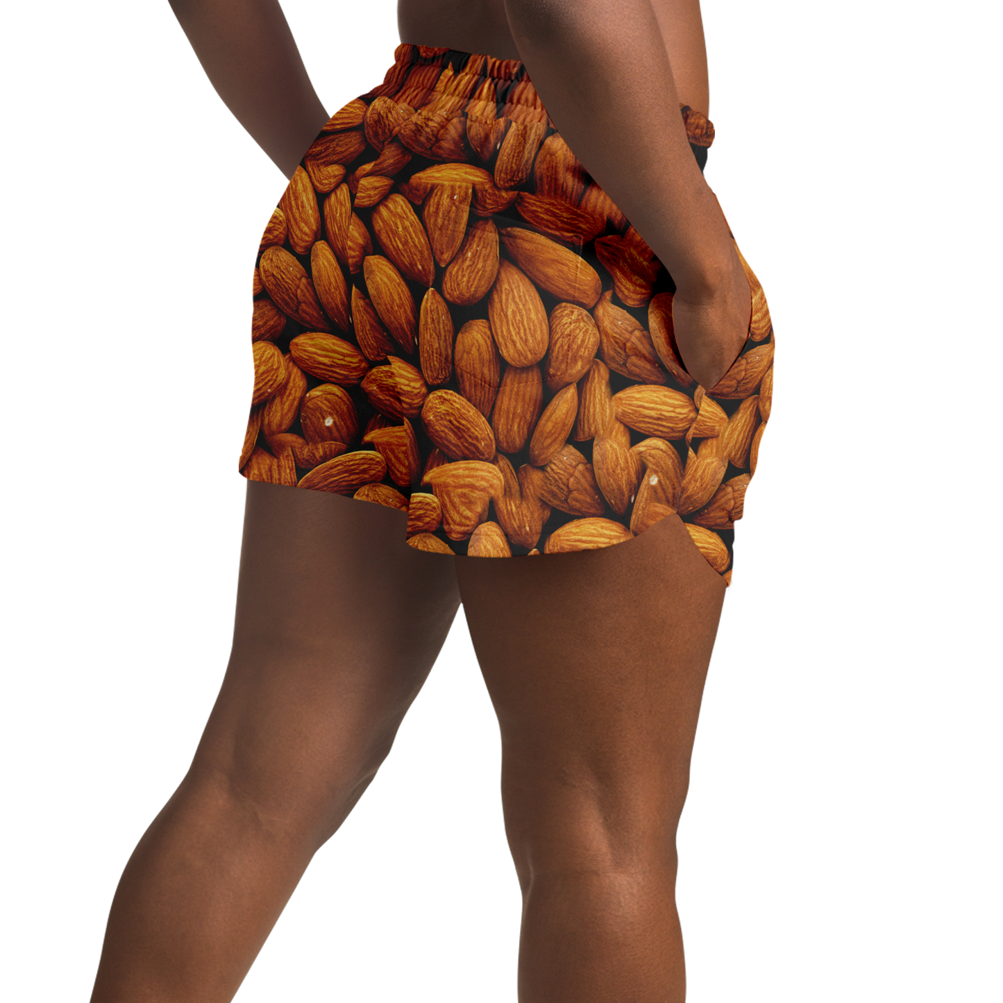 Close side view of model wearing Almond Flex Shorts with almond pattern design