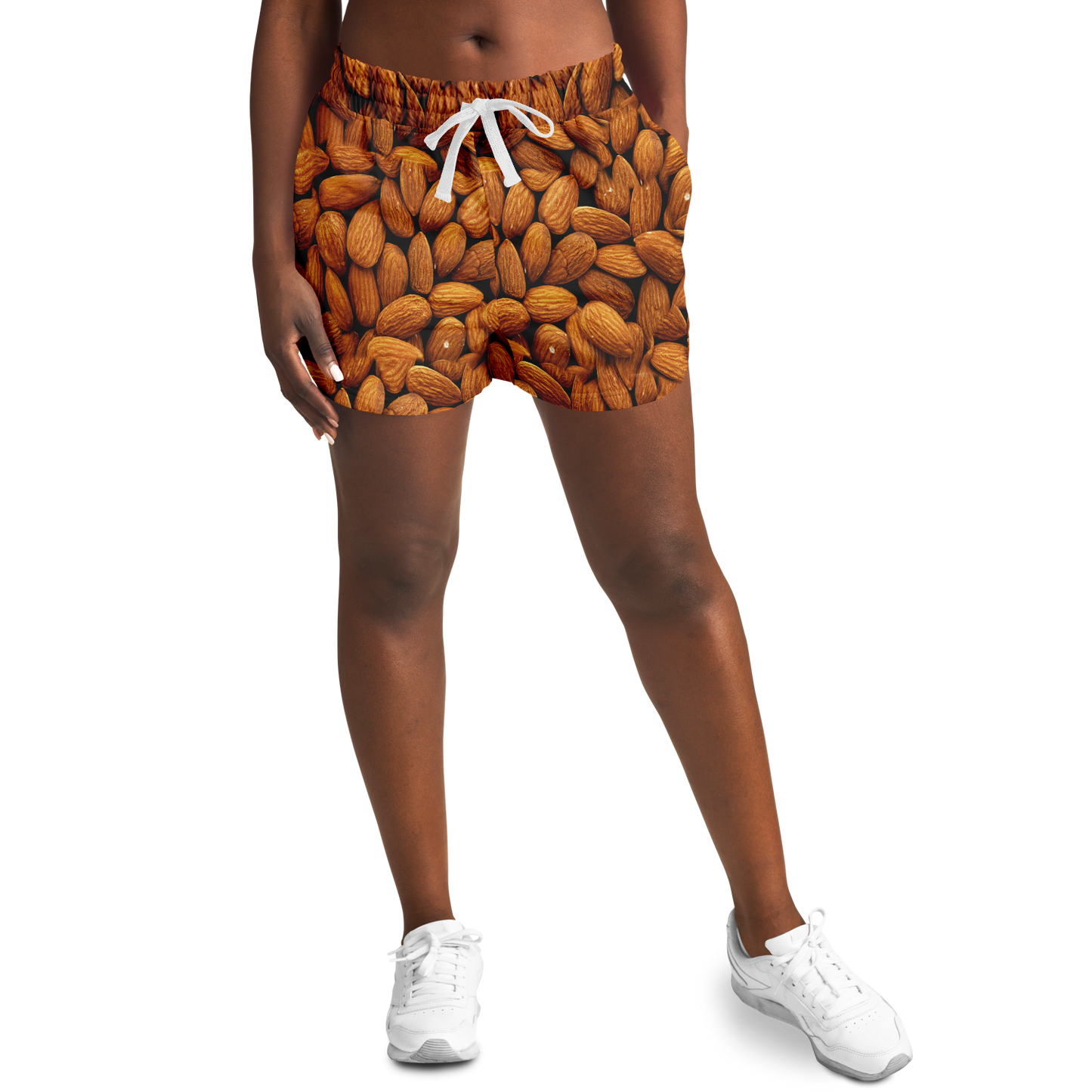 Model wearing Almond Flex Shorts front view with almond pattern design