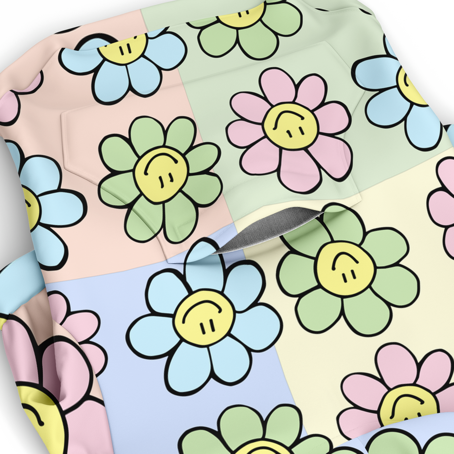 Close-up of pastel floral smiley pattern on dog hoodie fabric