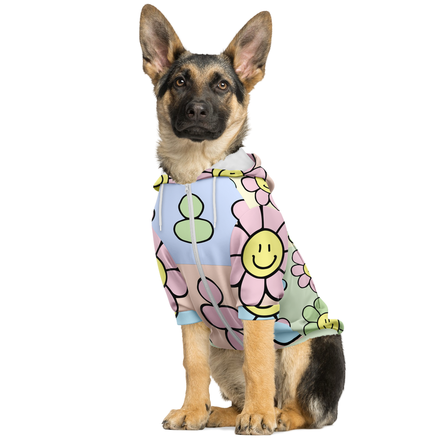 Dog sitting in floral print hoodie with pink and yellow smiley flowers