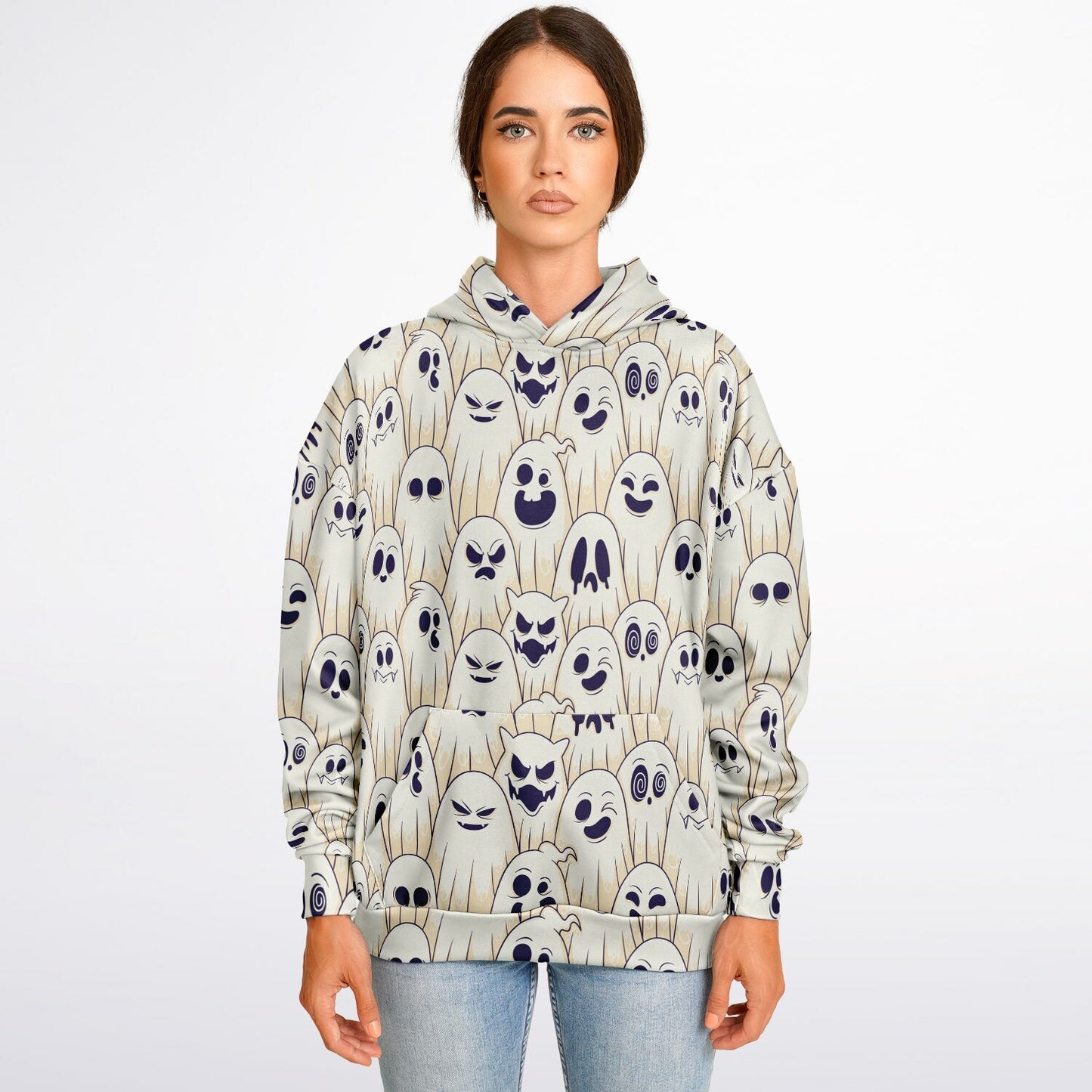 A woman wearing the Halloween hoodie with a pattern of cartoon ghosts with various expressions.
