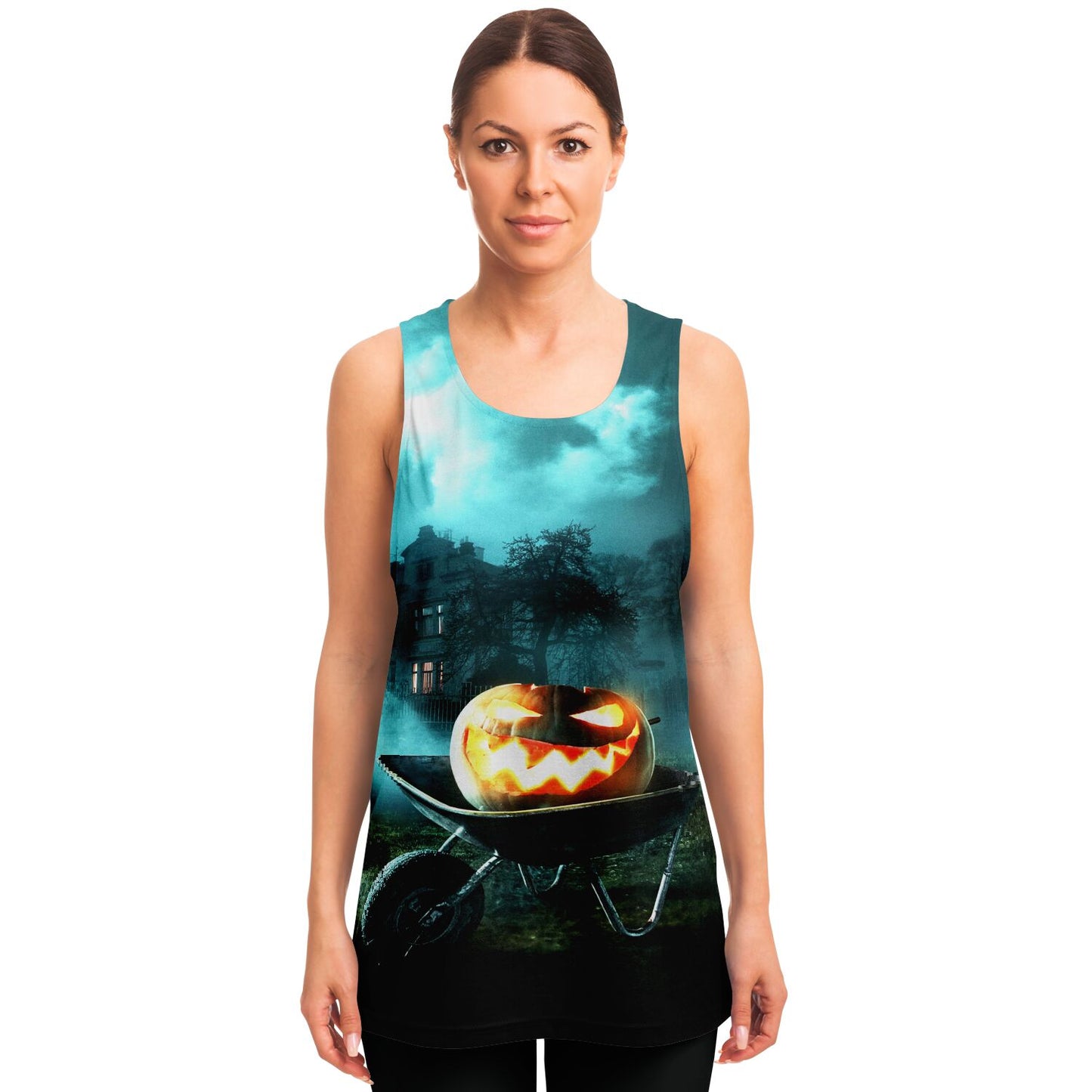 A woman wearing the Halloween tank top featuring a haunted pumpkin and wheelbarrow graphic.
