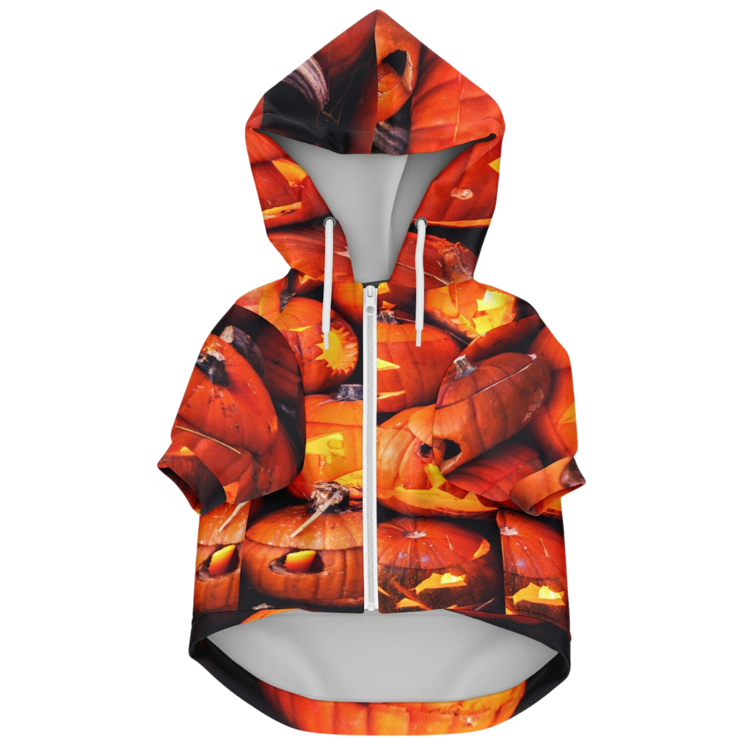 Front view of the Halloween pumpkin dog hoodie laid flat, showing the white zipper and hood.