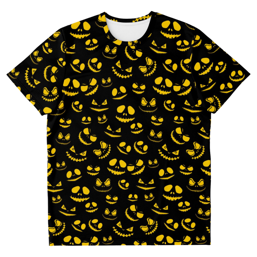 Front view of a black t-shirt laid flat, covered in a pattern of glowing yellow sinister pumpkin faces.