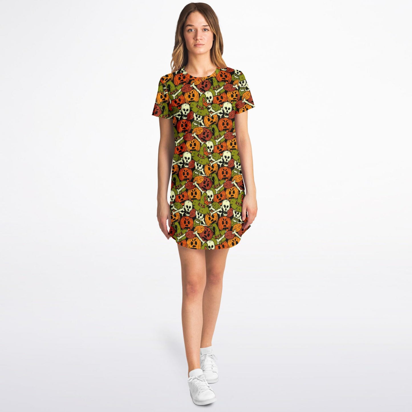 A woman wearing the skulls and pumpkins t-shirt dress, walking forward.