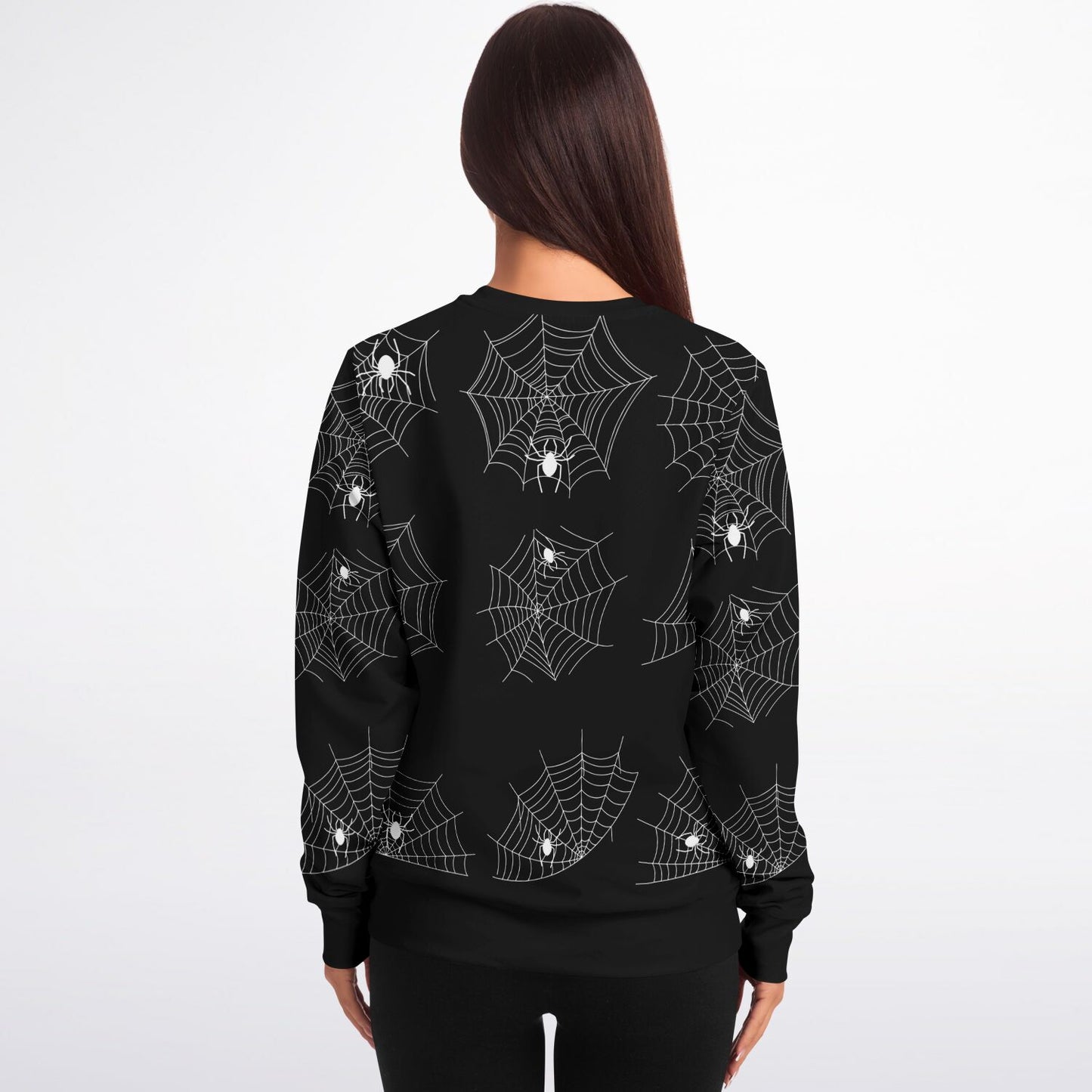 Back view of a woman wearing the black Halloween spiderweb sweatshirt.