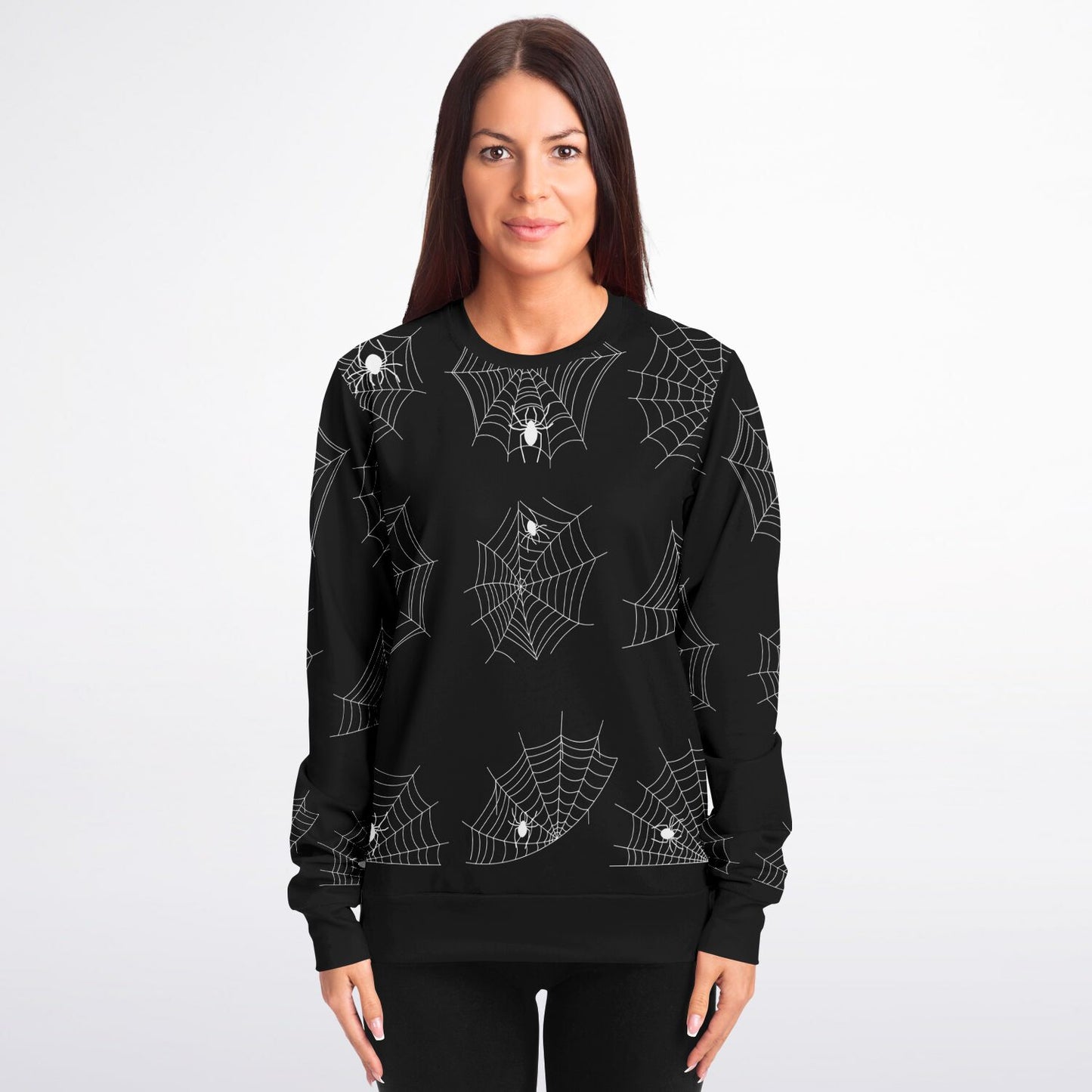 A woman wearing the black sweatshirt with a white spider and web all-over print.