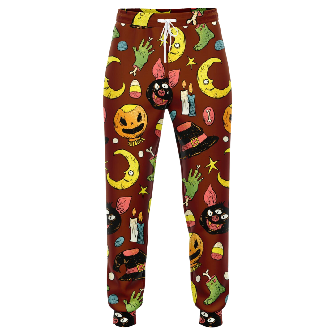 Front view of the Halloween-themed joggers laid flat, showing the repeating pattern of pumpkins and moons.