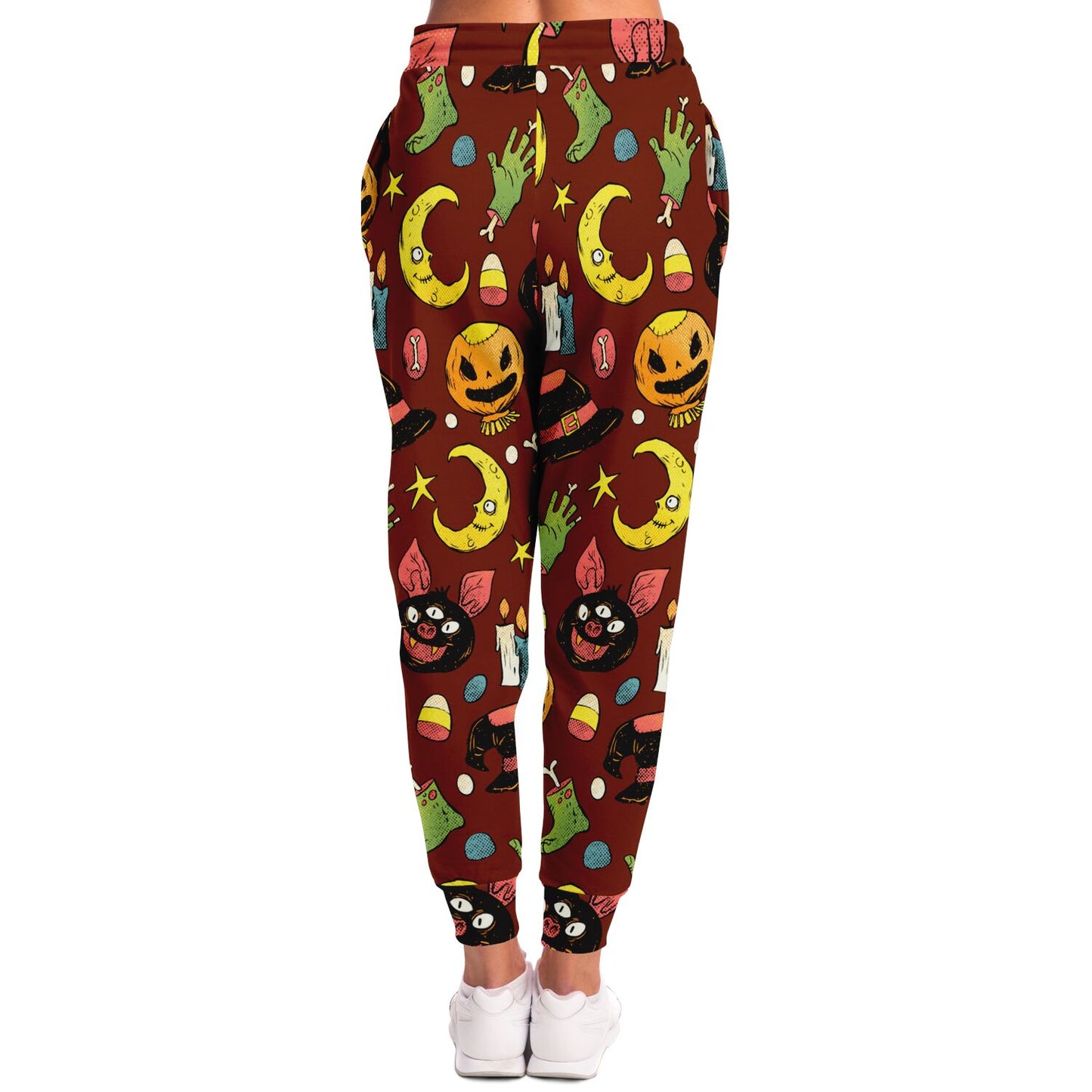 Back view of a woman wearing the brown joggers with the colorful Halloween doodle pattern.