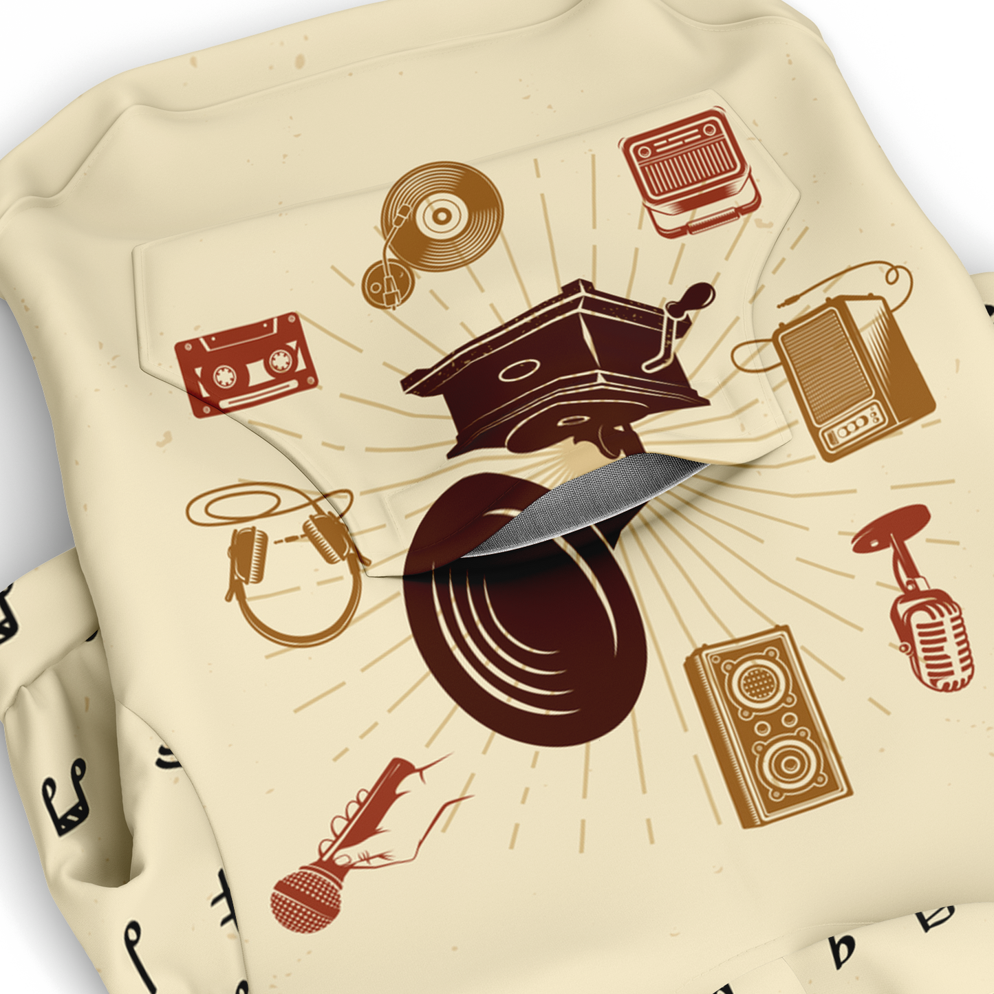 Close-up of music-themed print on beige dog hoodie fabric