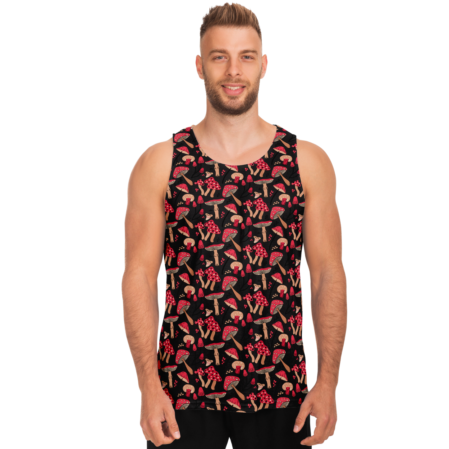 Male model standing front-facing wearing Nature Groove Tank Top with bold red mushroom and leaf pattern on black background