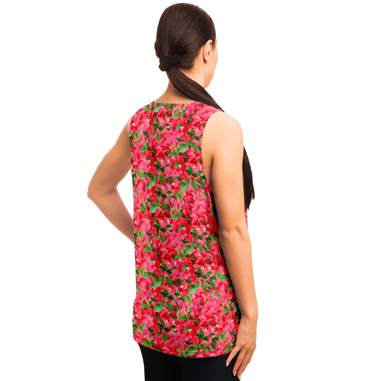Angled back pose of woman in Tropical Bloom Tank Top with colorful floral aesthetics