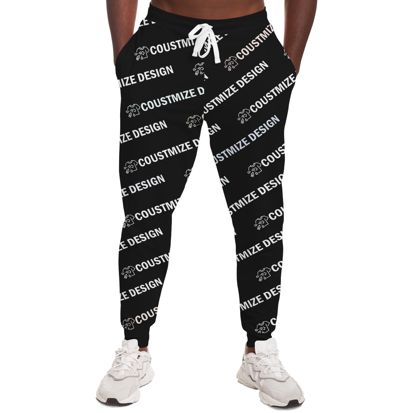 Man wearing black custom joggers featuring "YOUR DESIGN HERE" print, front view