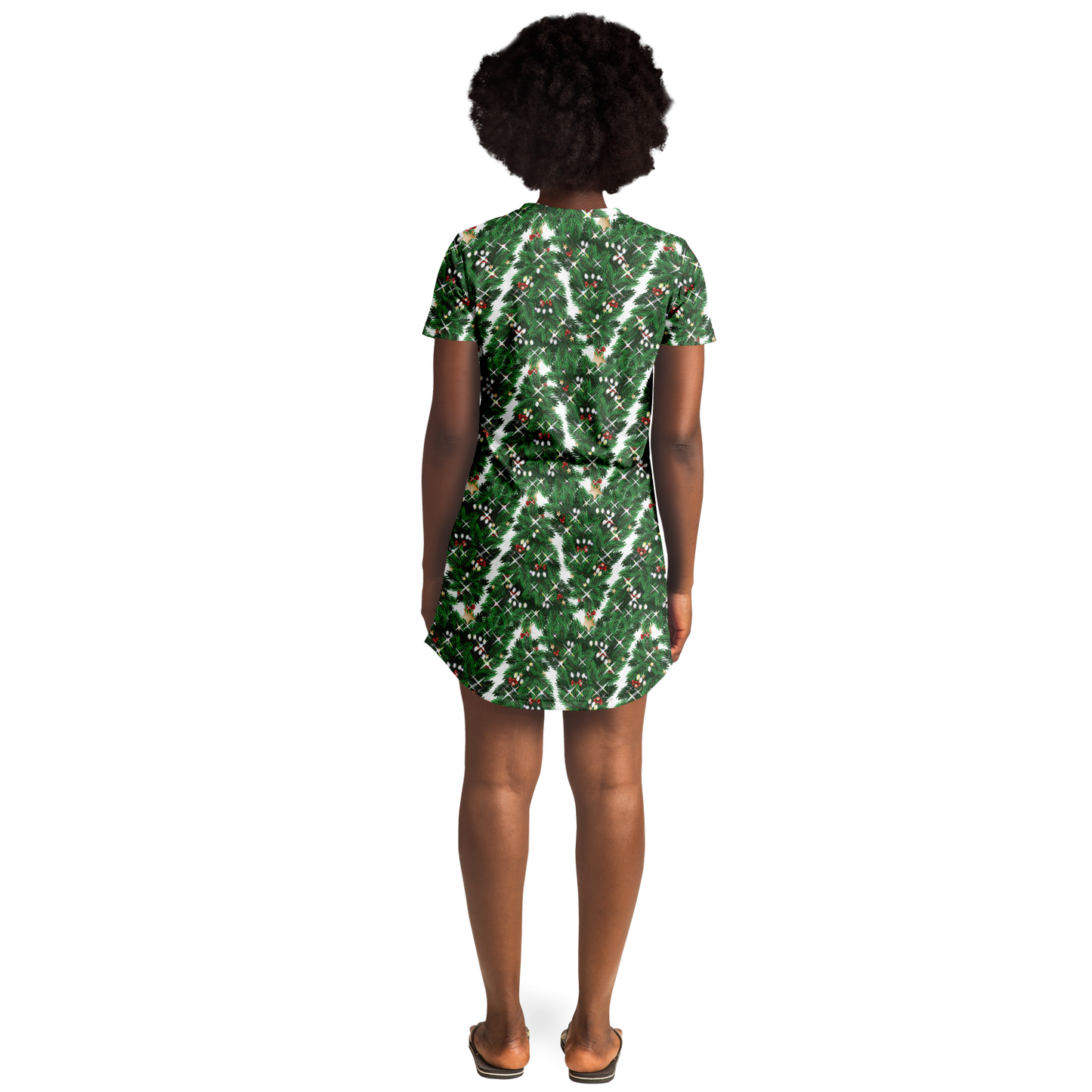 Woman standing with her back to the camera in a green Christmas tree t-shirt dress