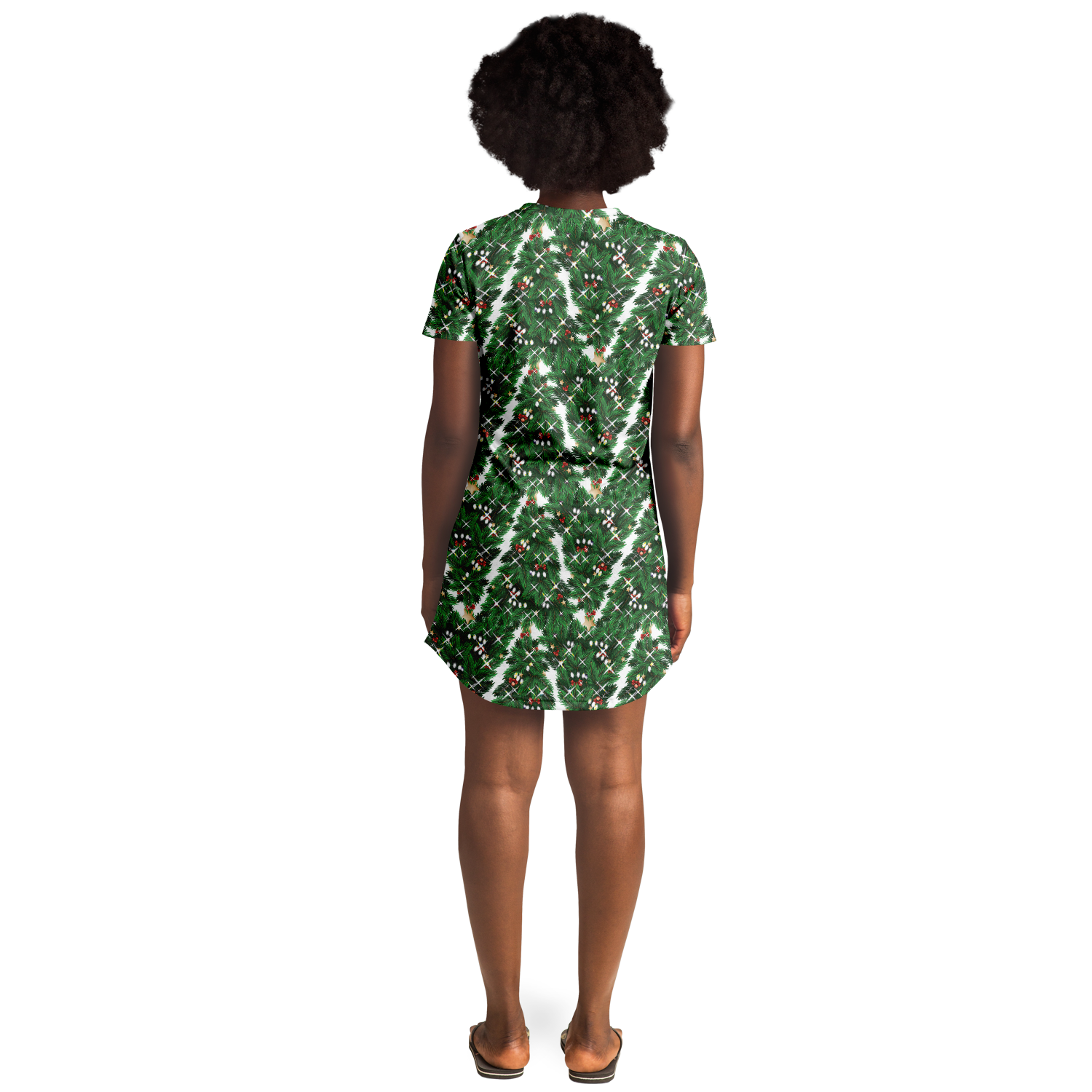 Woman standing with her back to the camera in a green Christmas tree t-shirt dress