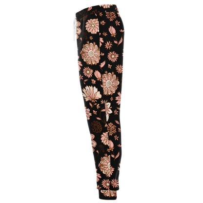  Floral Print Joggers – Side profile highlighting the graceful flow of peach floral motifs on black fabric