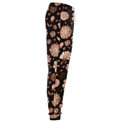  Floral Print Joggers – Side profile highlighting the graceful flow of peach floral motifs on black fabric