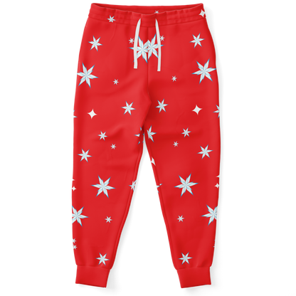 Front view of Festive Glow Joggers in red with white star pattern