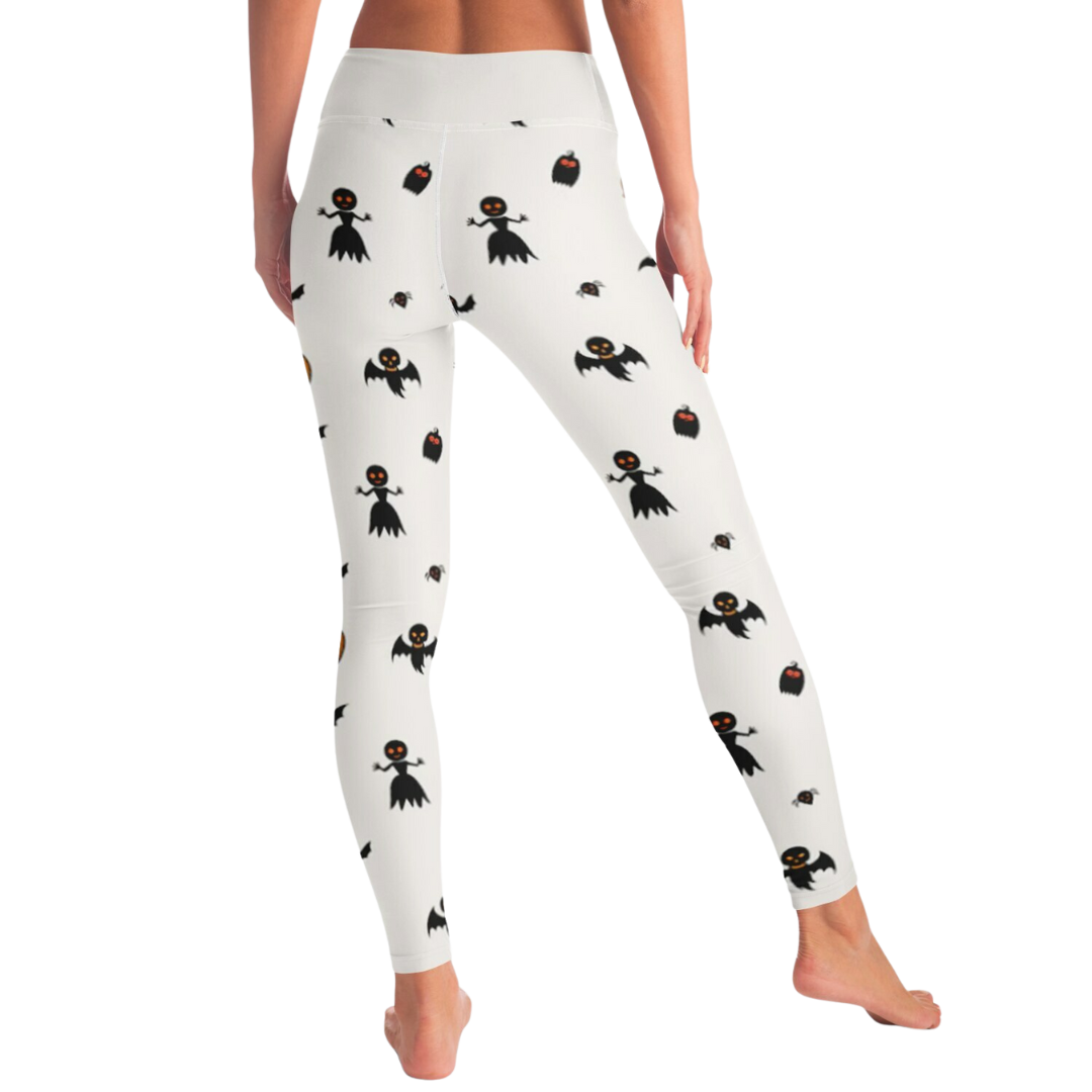 White leggings with black spooky  pattern worn by a person on a white background