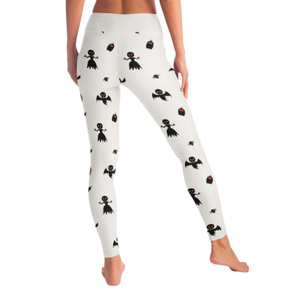 White leggings with black spooky  pattern worn by a person on a white background