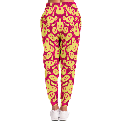  Smiley Loop Joggers – Action-ready women pose with bright emoji pattern, ideal for casual style