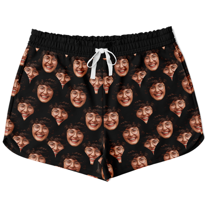 Flatlay front view of Custom Face Shorts featuring all-over personalized face print on black fabric