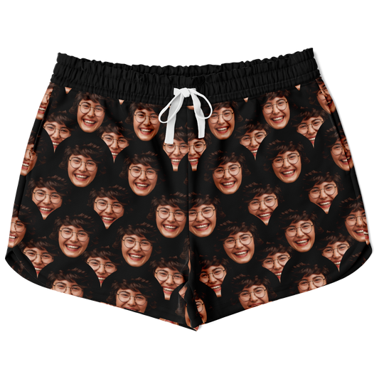 Flatlay front view of Custom Face Shorts featuring all-over personalized face print on black fabric