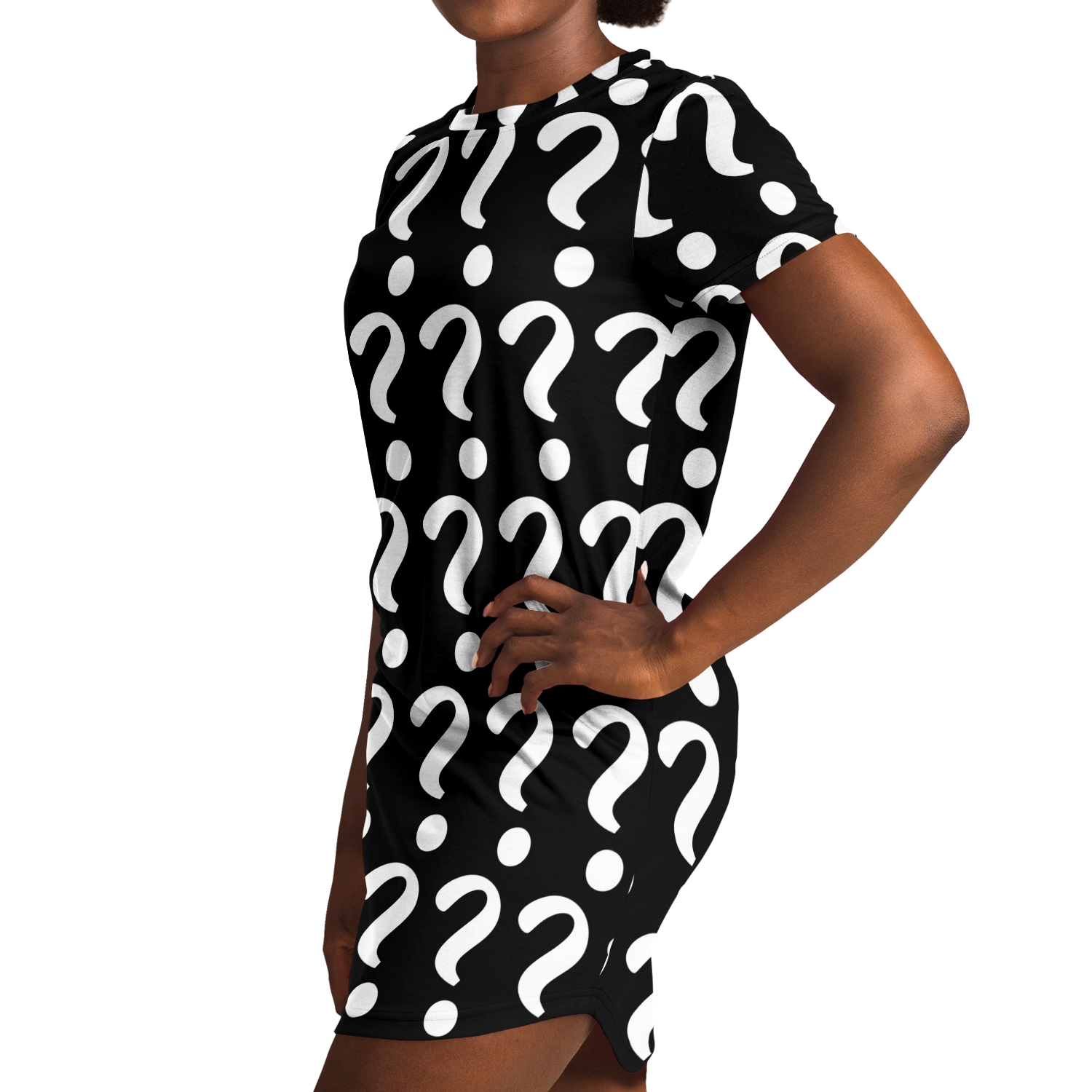 Side profile view of a woman wearing a custom T-shirt dress with all-over placeholder print, hands on hips in confident stance