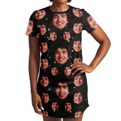 Woman modeling custom face t-shirt dress, hands on hips, black background with face design