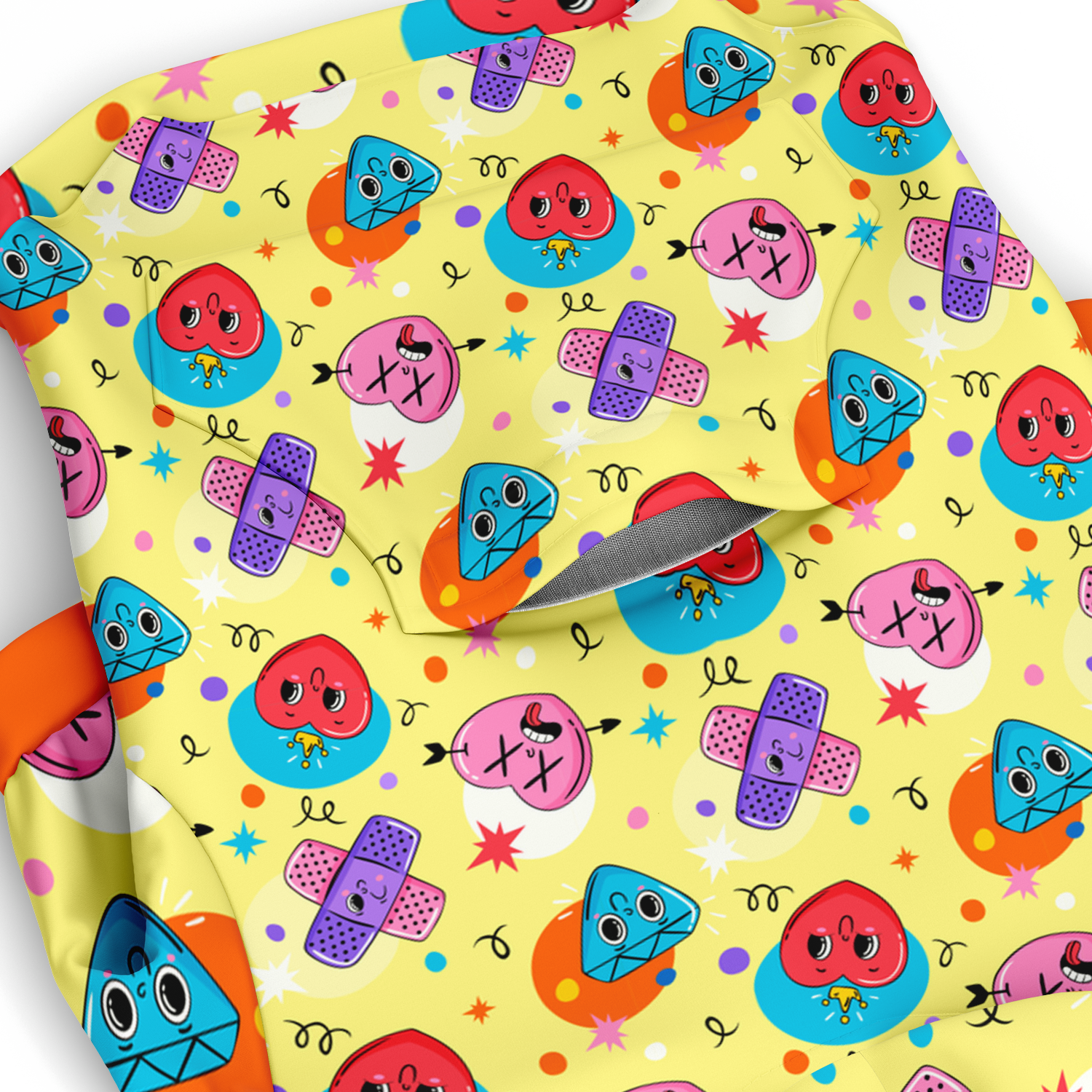 Close-up of emoji pattern on dog hoodie with smiling and winking faces