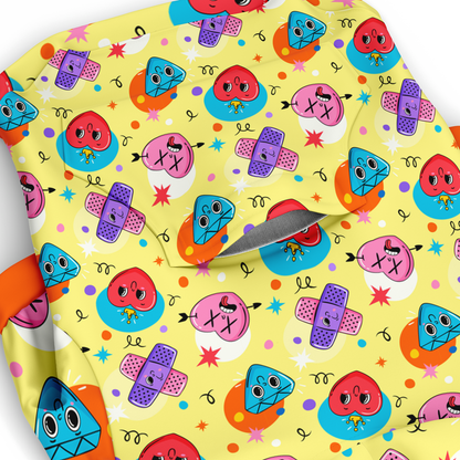 Close-up of emoji pattern on dog hoodie with smiling and winking faces