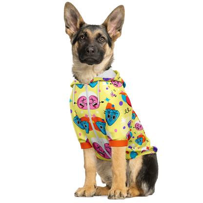 Dog sitting in emoji print dog hoodie with all-over fun expressions