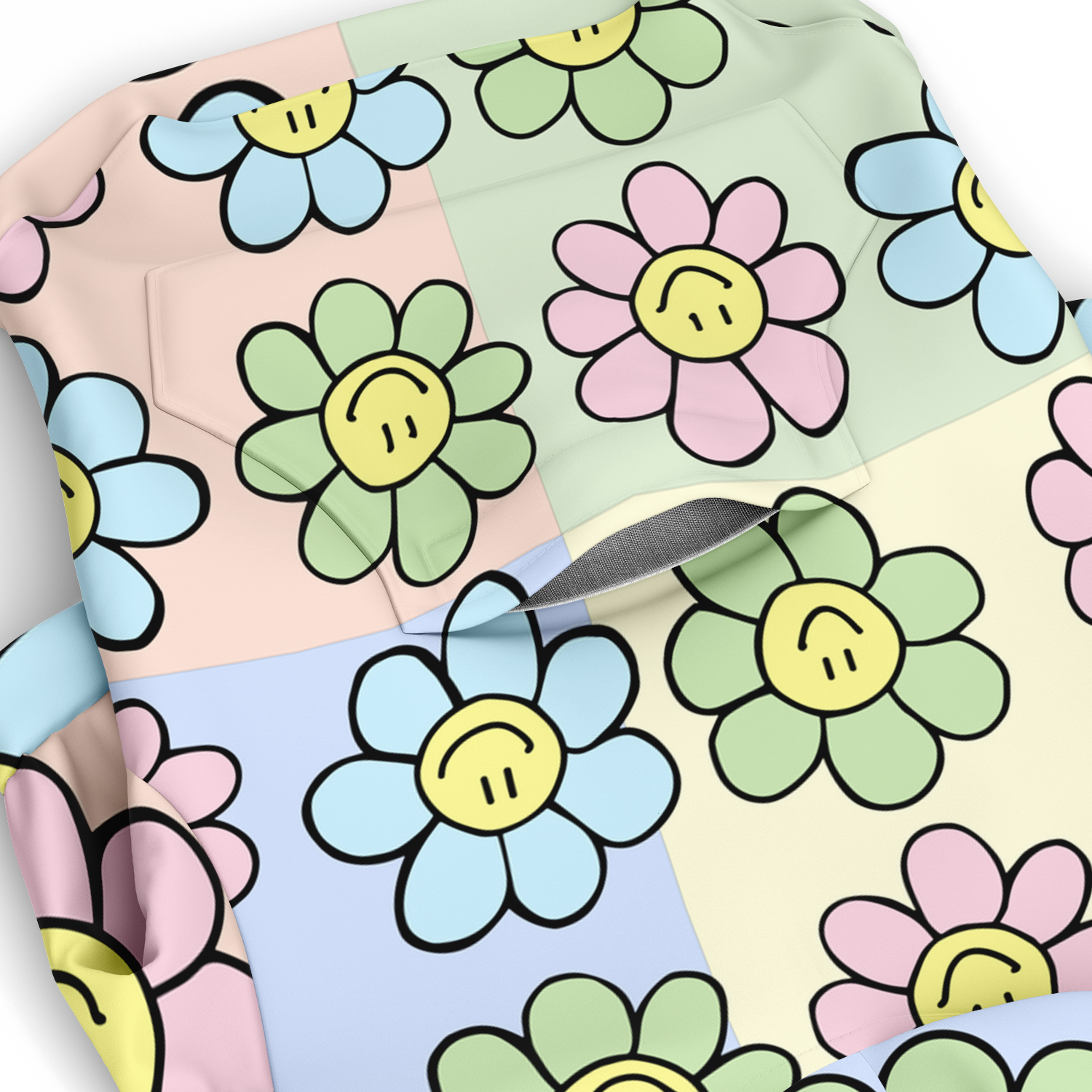 Close-up of pastel floral smiley pattern on dog hoodie fabric