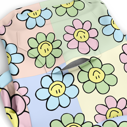 Close-up of pastel floral smiley pattern on dog hoodie fabric