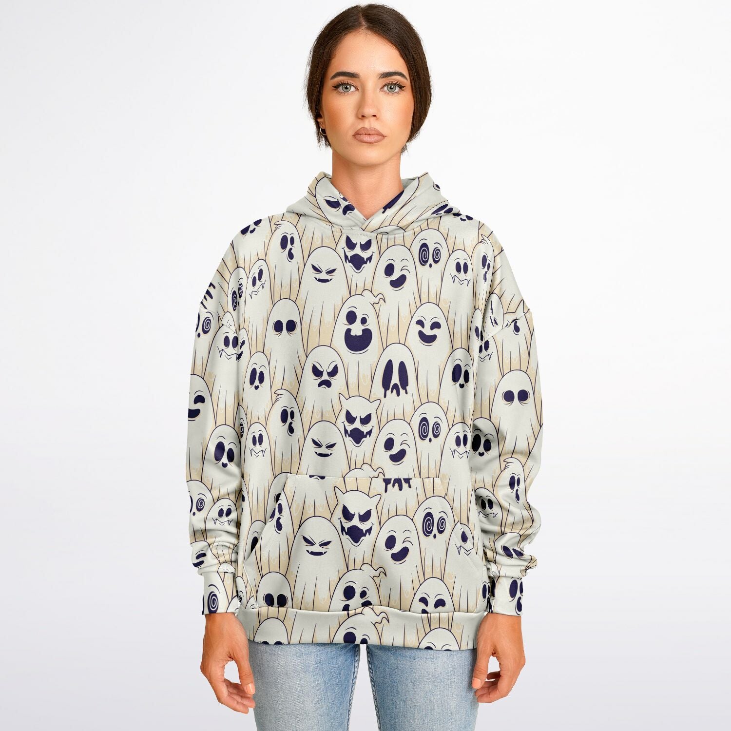 A woman wearing the Halloween hoodie with a pattern of cartoon ghosts with various expressions.