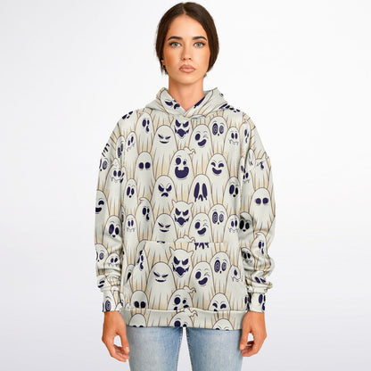 A woman wearing the Halloween hoodie with a pattern of cartoon ghosts with various expressions.