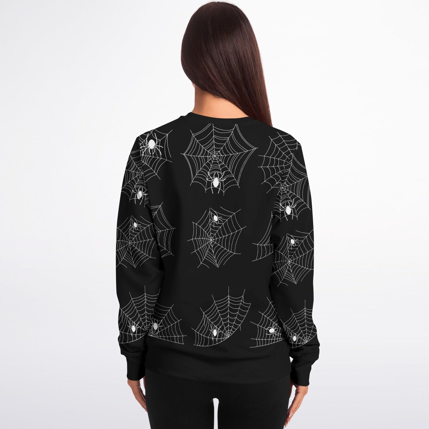 Back view of a woman wearing the black Halloween spiderweb sweatshirt.