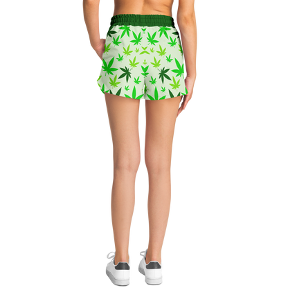  Model wearing High Vibe Shorts back view with green cannabis leaf design