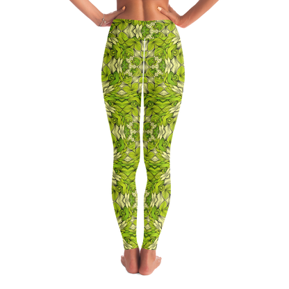 Back view of leaf print leggings with green leafy pattern and hands on waist pose