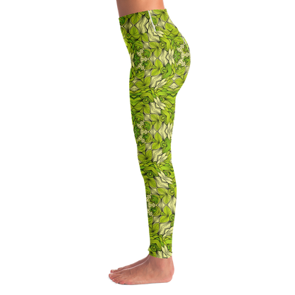 Left side view of green leaf print leggings with detailed foliage-inspired design