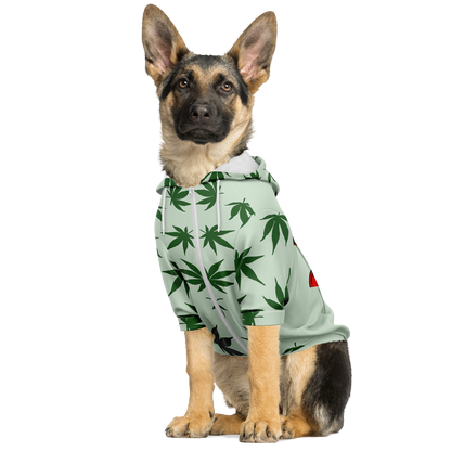 Dog in leaves print hoodie — side view sitting pose with zipper front and hood