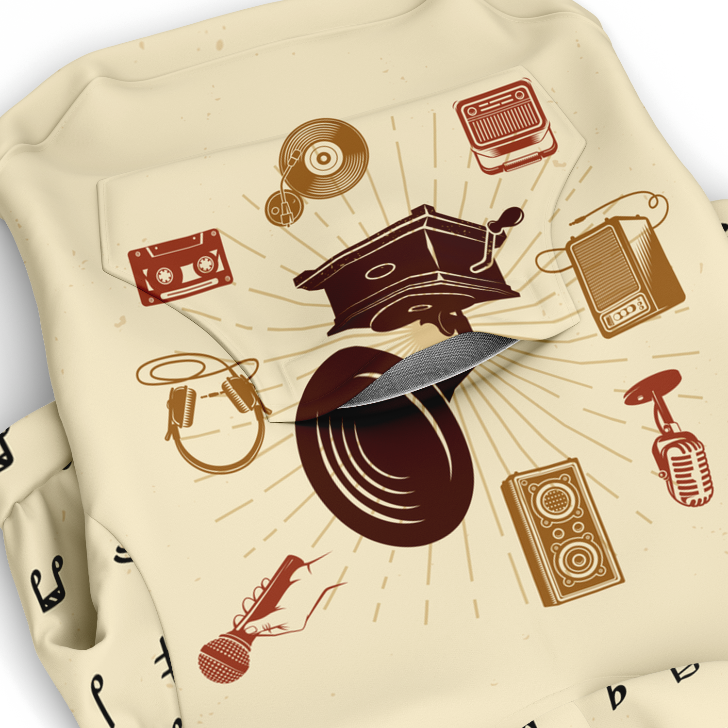 Close-up of music-themed print on beige dog hoodie fabric