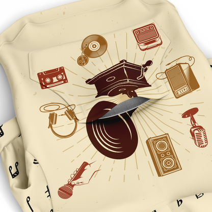 Close-up of music-themed print on beige dog hoodie fabric