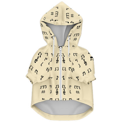 Front flat lay of Melody Beige dog hoodie with black music note pattern and zipper