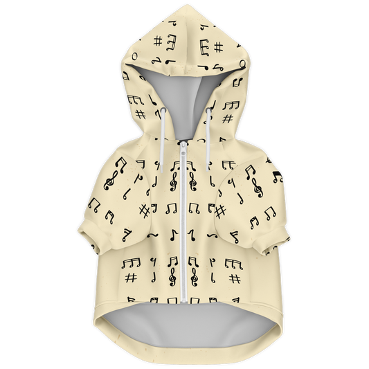 Front flat lay of Melody Beige dog hoodie with black music note pattern and zipper