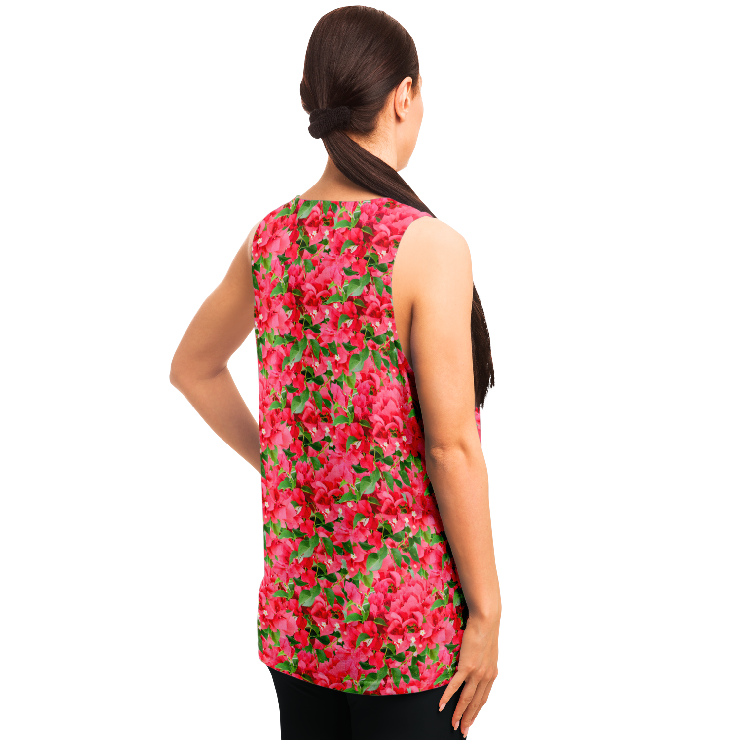 Angled back pose of woman in Tropical Bloom Tank Top with colorful floral aesthetics