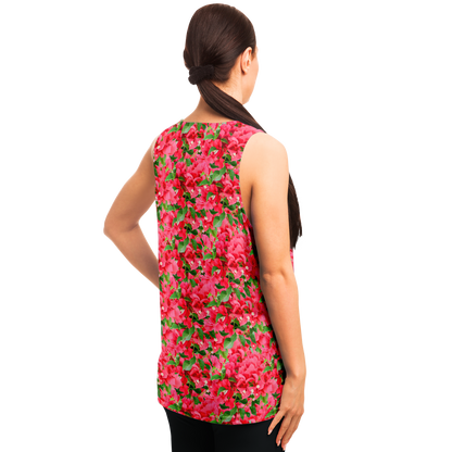 Angled back pose of woman in Tropical Bloom Tank Top with colorful floral aesthetics