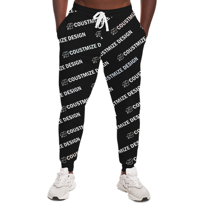 Man wearing black custom joggers featuring "YOUR DESIGN HERE" print, front view
